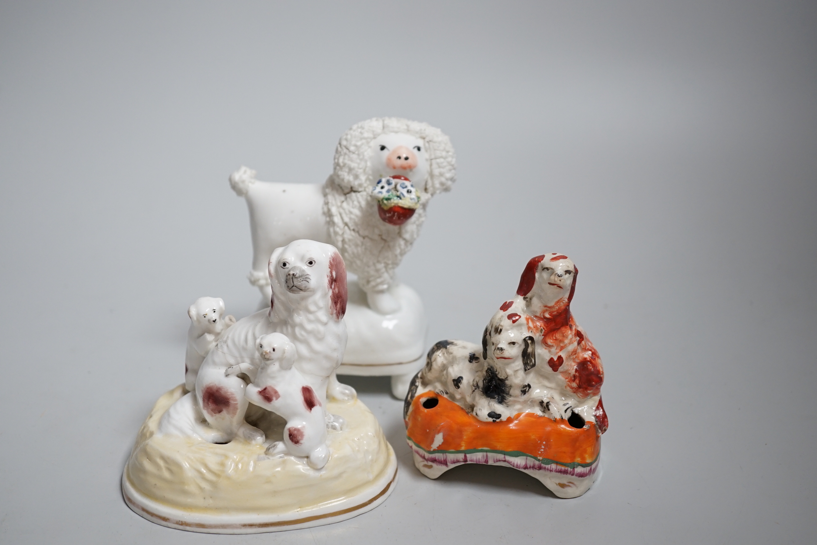 Five Victorian Staffordshire dog groups, the largest 12cm high